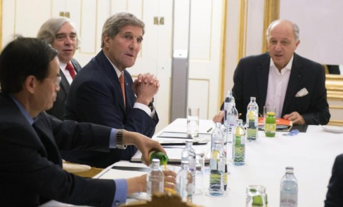 US Secretary of State John Kerry, second right, US Secretary of Energy Ernest Moniz, second left, and French Foreign Minister Laurent Fabius, right, meet at Palais Coburg Hotel, where the Iran nuclear talks are being held, in Vienna, Austria, Tuesday, July 14, 2015. After 18 days of intense and often fractious negotiation, diplomats Tuesday declared that world powers and Iran had struck a landmark deal to curb Iran's nuclear program in exchange for billions of dollars in relief from international sanctions, an agreement designed to avert the threat of a nuclear-armed Iran and another U.S. military intervention in the Muslim world. (Joe Klamar/Pool Photo via AP)